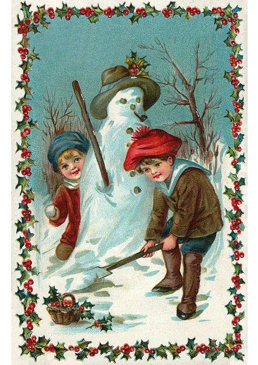 enfants contruisent bonhomme de neige