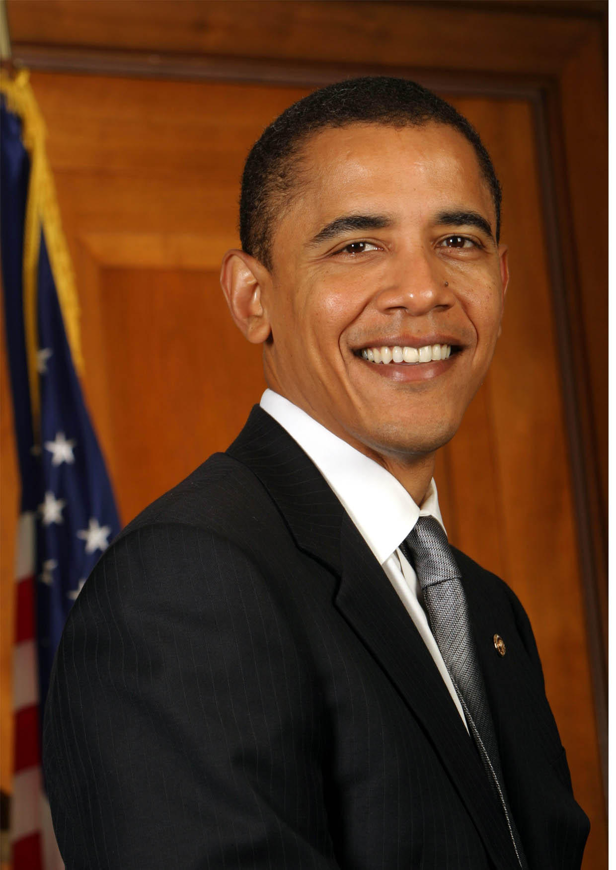 Photo De Barack Obama Souriant En Costume Noir Avec Une Cravate Devant 